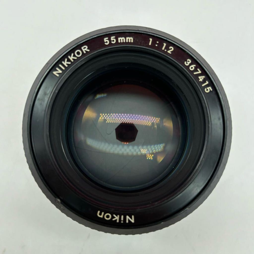 * Nikon NIKKOR 55mm F1.2 camera lens manual focus single burnt point Nikon 