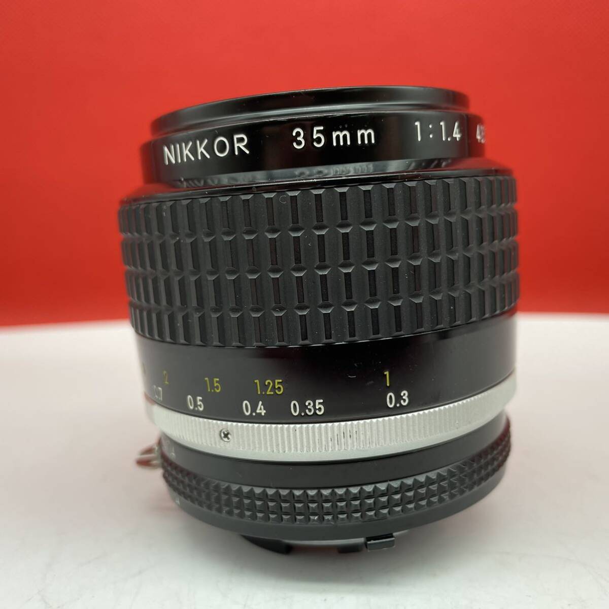 * use several times Nikon NIKKOR 35mm F1.4 Ai-s camera lens single burnt point manual focus Nikon 