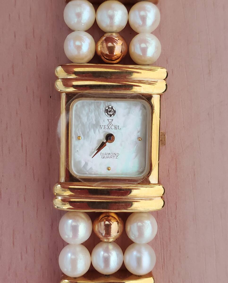 14852[ long-term keeping goods * deterioration equipped * operation not yet verification ]VEXCELvek cell 3 ream pearl watch shell face wristwatch packing less . shipping 
