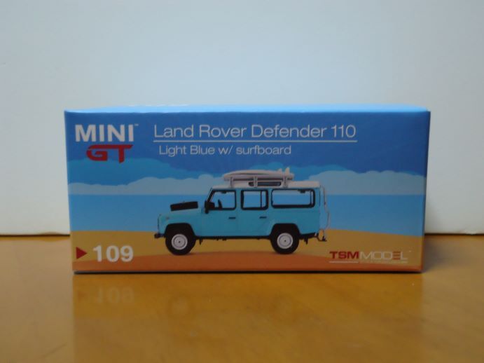 ★MINI GT 1/64　Land Rover Defender 110　ランドローバー デイフェンダー　ライトブルー サーフボード付き　　109★_画像1