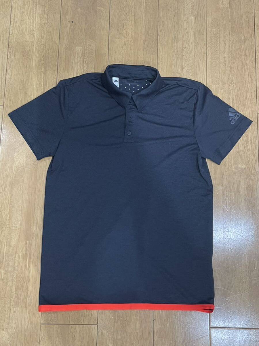 【使用2回】adidasポロシャツ Lサイズ アディダス 半袖 黒系 オレンジ ゴルフ トレーニングの画像1
