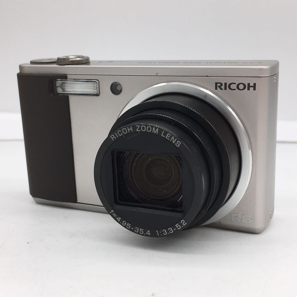 RICHO Ricoh R8 серебряный компактный цифровой фотоаппарат цифровая камера темно синий teji инструкция * зарядное устройство * аккумулятор * специальный чехол * оригинальная коробка приложен рабочее состояние подтверждено 