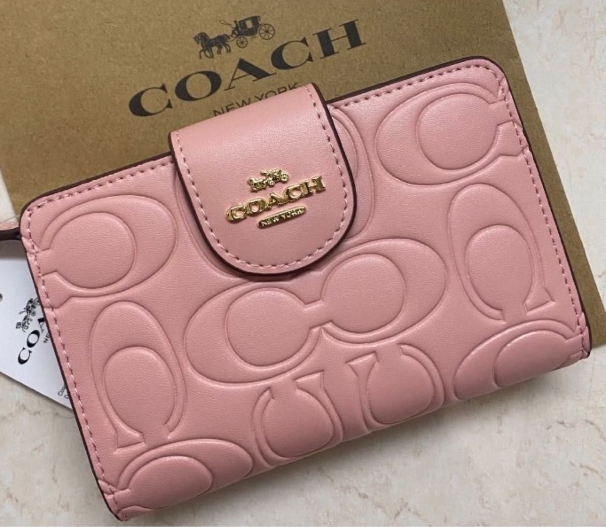 新品未使用　coachコーチ　ピンクシグネチャー　ミディアム二つ折り財布