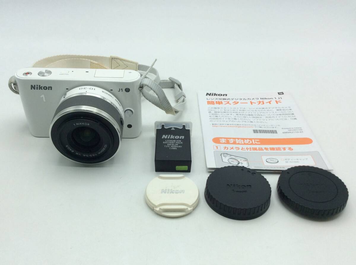 RR54♪＜通電/動作/精度未確認＞ジャンク デジタルカメラ Nikon ニコン J1 ホワイト 10-30mm 1:3.5-5.6 VR φ40.5 冊子付き 現状品♪_画像1