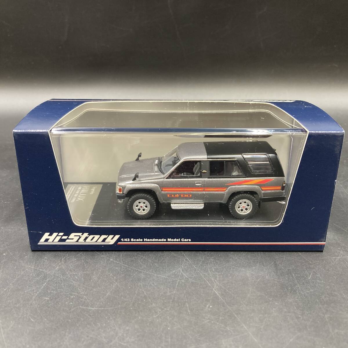 BQ3024 ハイストーリー 1/43 Toyota HILUX 4WD SURF SSR 1985 ダークグレーメタリック ミニカー_画像1