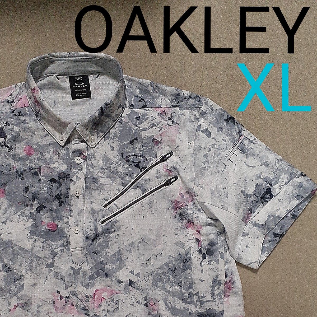 【超美品】OAKLEY オークリー　 ボタンダウン　半袖ポロシャツ　ゴルフ　グレー×ピンク　メンズXL　ポロシャツ　高機能　スカル