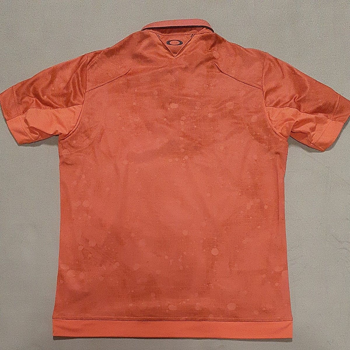 【超美品】OAKLEY オークリー　半袖ポロシャツ　ゴルフ　オレンジ　メンズXL　ポロシャツ　高機能　スカル
