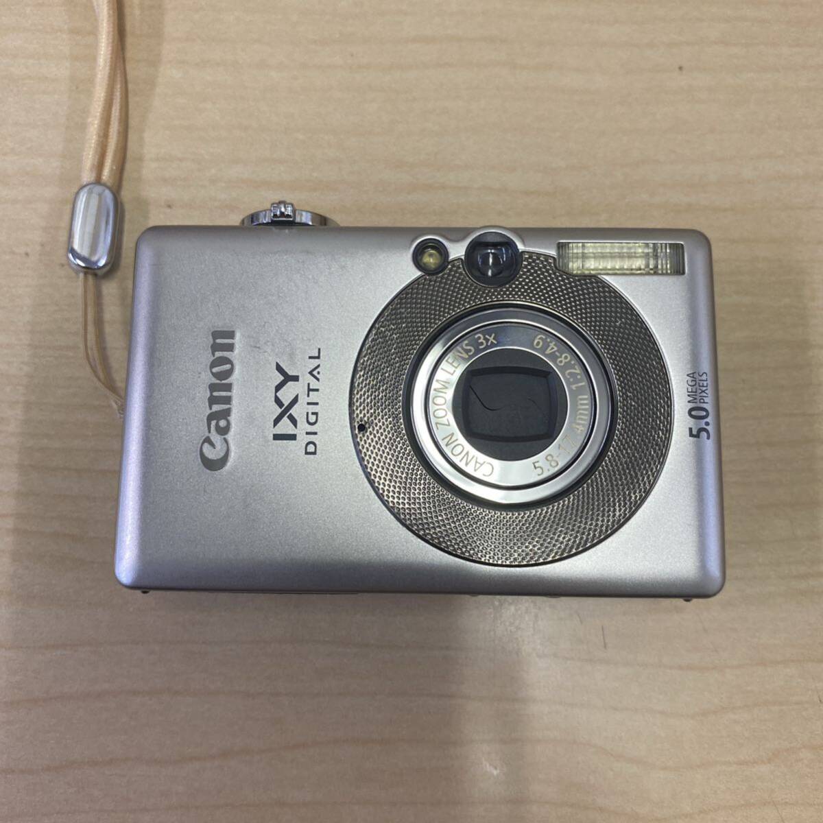 【TM0507】 Canon IXY DIGITAL 55 コンパクトデジタルカメラ コンデジ キャノン シルバーカラー 通電確認済 キズあり 汚れあり_画像2