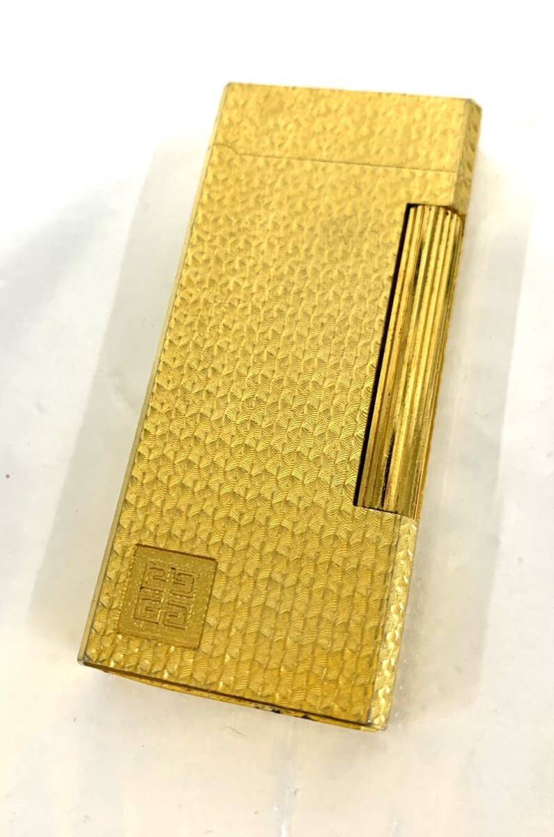  fire kind not yet verification smoking .GIVENCHY/ Givenchy 2000 gas lighter Gold color present condition goods ka4