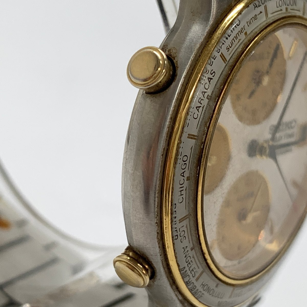 f001 Z4 62. SEIKO WORLD TIME セイコー ワールドタイム 5T52-7A00 クォーツ QZ クロノグラフ デイト 腕時計 白文字盤 ホワイト 動作品の画像3