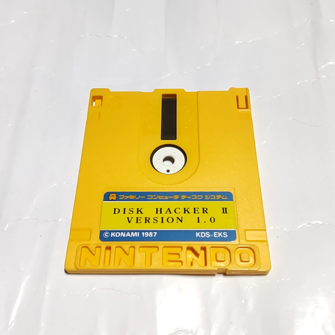 ディスクカード：A面・DISK HACKER Ⅱ（VERSION1.0）B面・子育てゴッコ［動作品］中身違い、磁気フィルムにキズありジャンク品の画像1