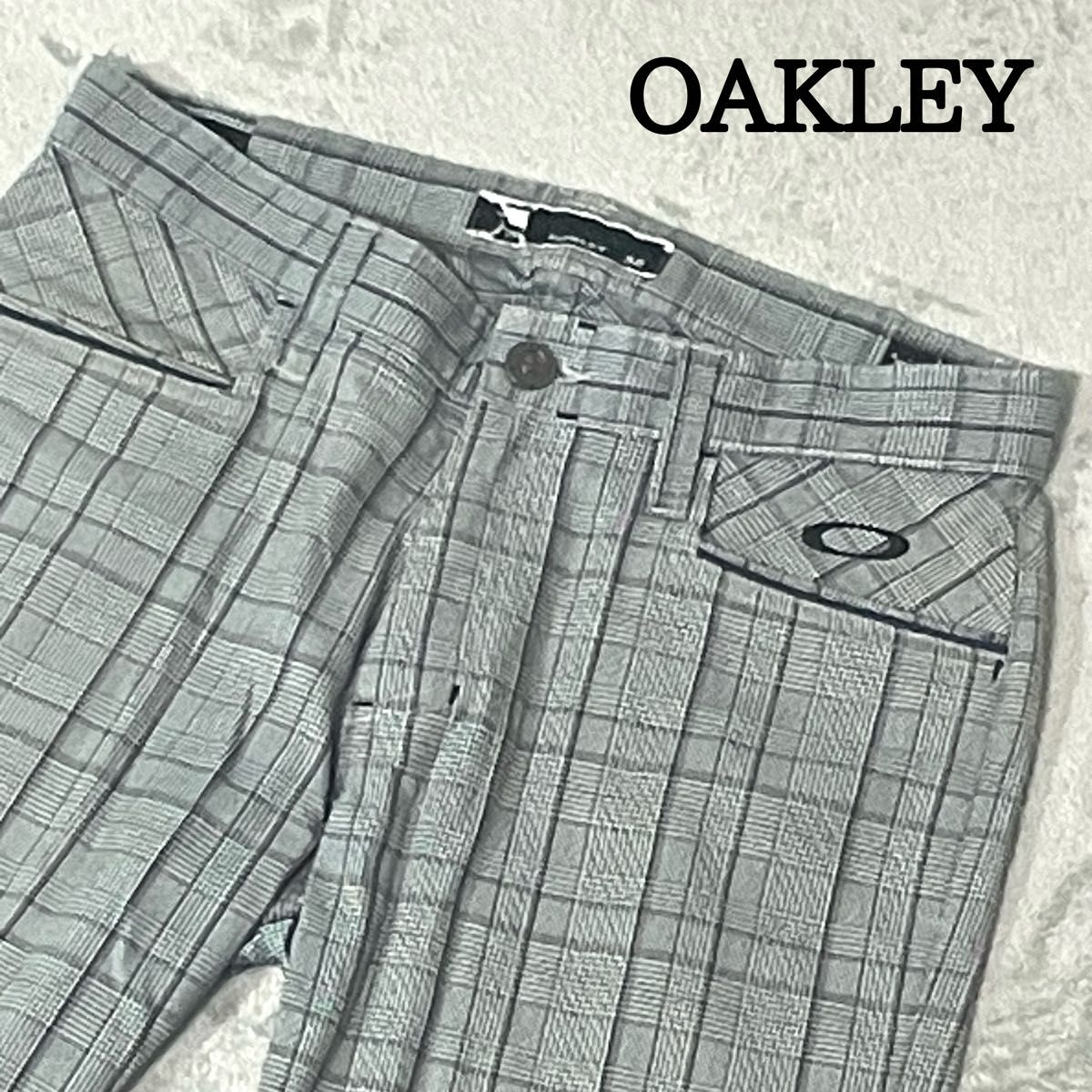 美品 オークリー OAKLEY ゴルフウェア パンツ ギンガムチェック柄 立体裁断 3D スカル刺繍 32 水色 グレー