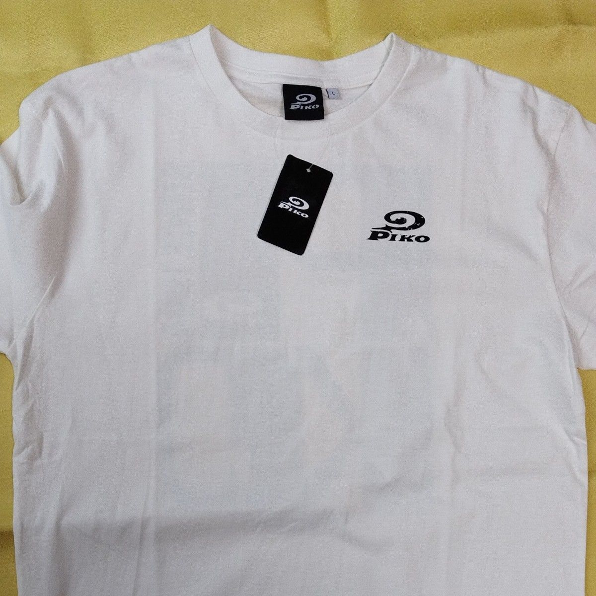 ▼1376　ピコ　PIKO 半袖Tシャツ Lサイズ オフホワイト 　未使用新品　タグ付　　　