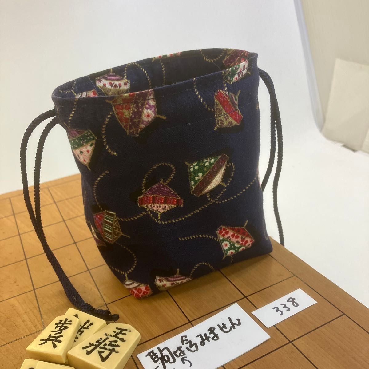 A cute bag . Ａspinning top mark=koma in Jap駒袋:持ち運びが便利な巾着タイプNo.338