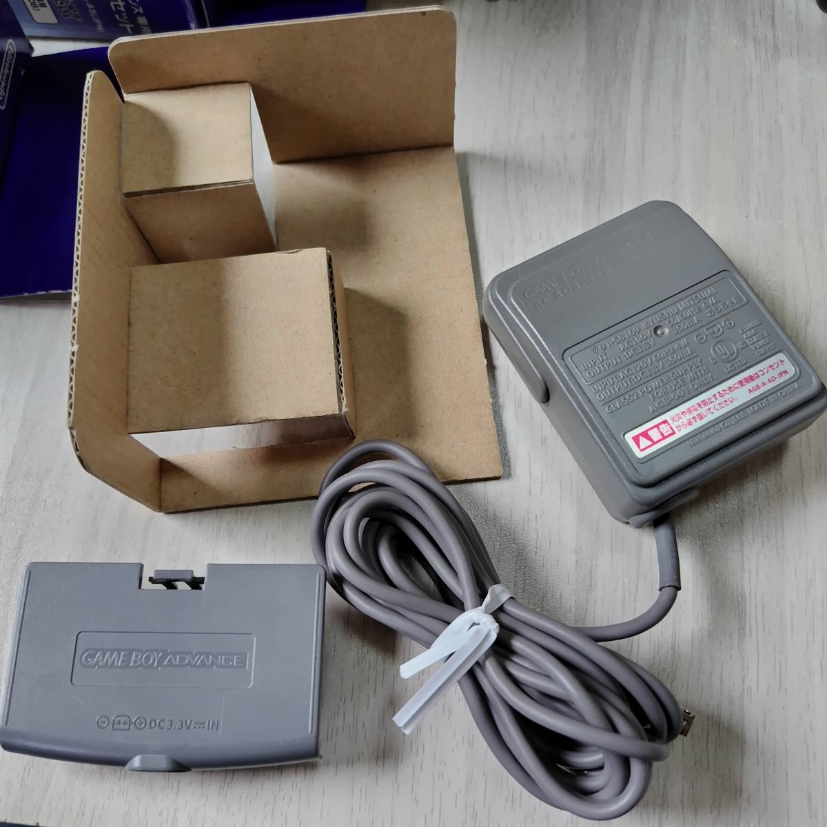 * Game Boy Advance exclusive use AC adaptor set box attaching what pcs . including in a package possible *1