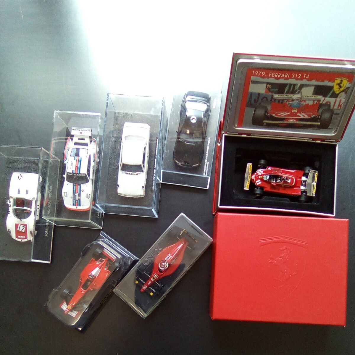 7台セット／ポルシェ910 ポルシェ935 日産GTR ハコスカ スカイライン フェラーリ 312 T4 JODY SCHECKTER 箱入り BOOK型 缶ケース付【b278】_画像1