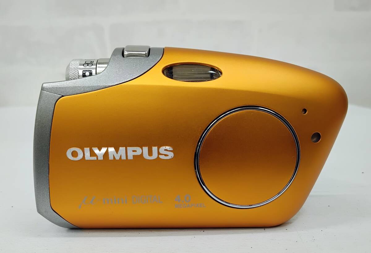 OLYMPUS/ Olympus μ-mini DIGITAL 4.0megapixel orange электризация * работоспособность не проверялась Junk с некоторыми замечаниями текущее состояние товар 