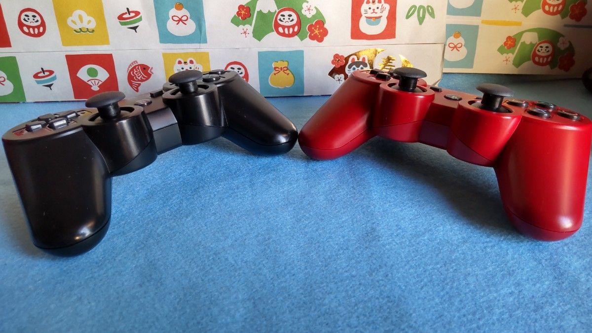 PS3 DUALSHOCK3 デュアルショック３ブラックとガーネット・レッド1個おまけUSBケーブル1本