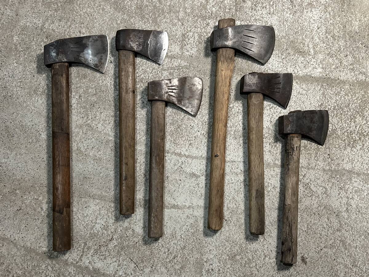  mountain . tool firewood tenth branch strike axe hatchet set together hand strike mountain . earth .. industry carpenter's tool old tool f