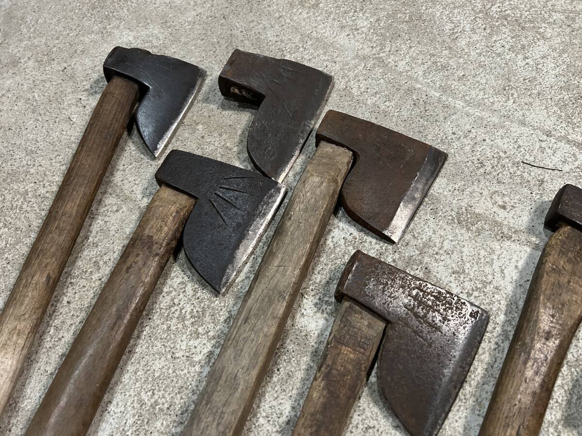  mountain . tool firewood tenth branch strike axe hatchet set together hand strike mountain . earth .. industry carpenter's tool old tool gm