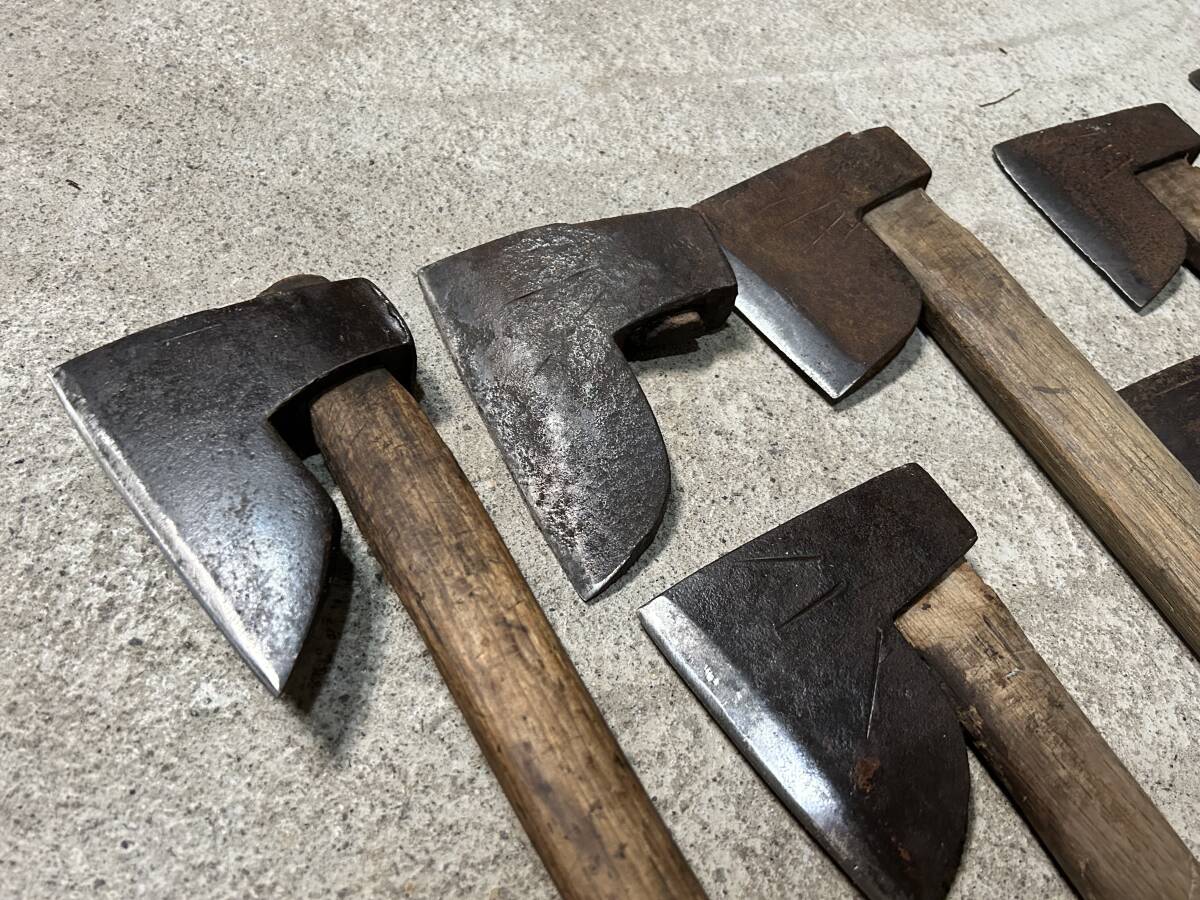  mountain . tool firewood tenth branch strike axe hatchet set together hand strike mountain . earth .. industry carpenter's tool old tool gm