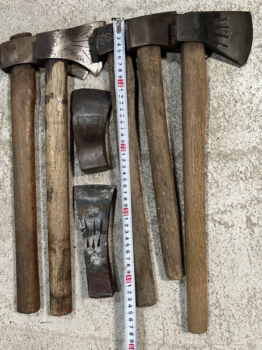  mountain . tool firewood tenth branch strike axe hatchet set together hand strike mountain . earth .. industry carpenter's tool old tool dn