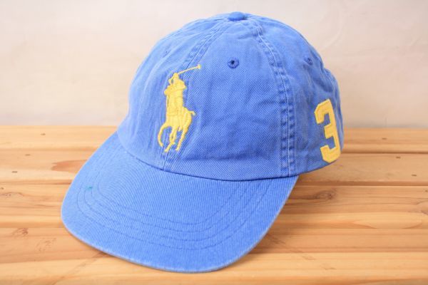 blue and yellow polo hat