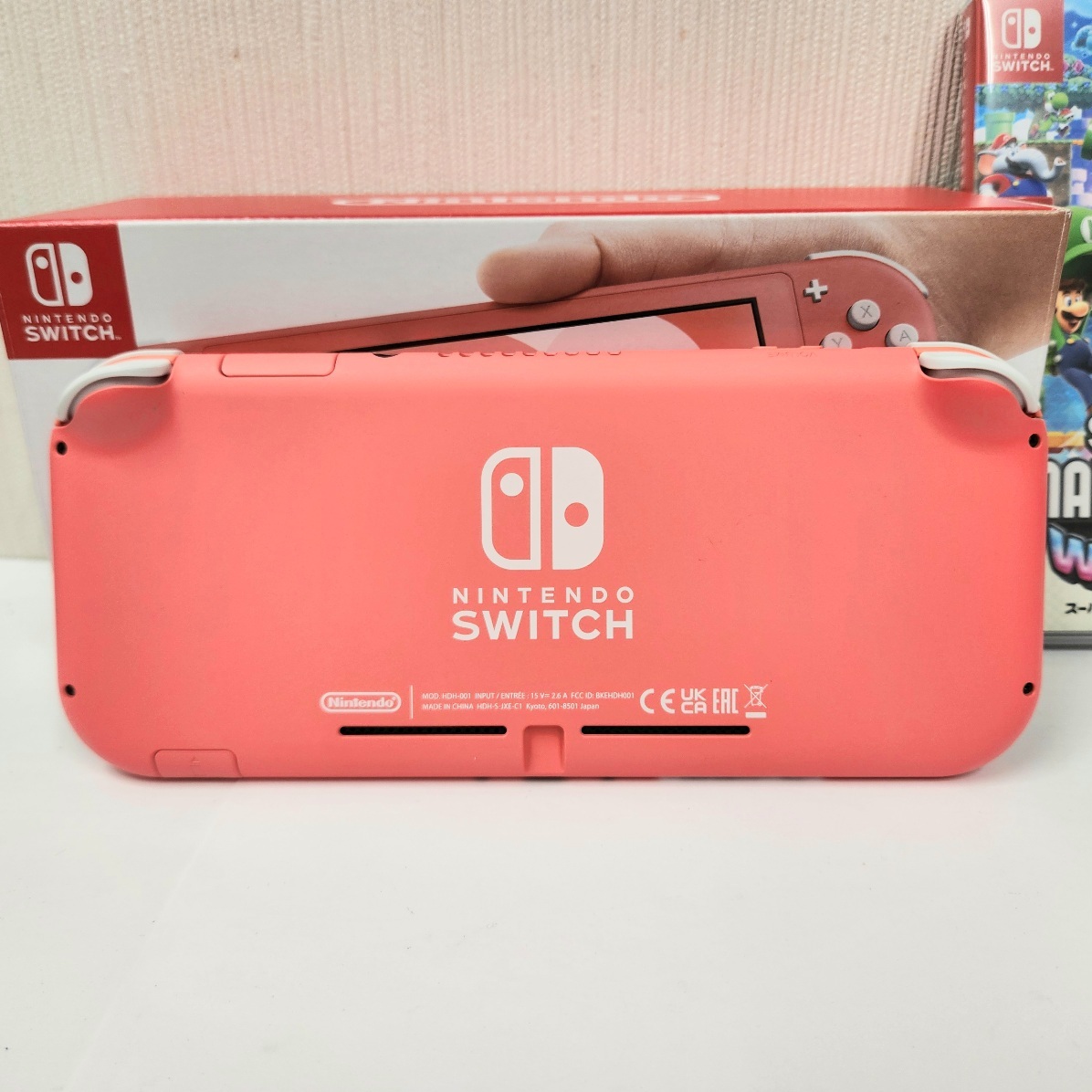 C-05071K【電源起動確認済】NINTENDO SWICH Lite ニンテンドウ スウィッチ ライト コーラル ピンク ソフト付き マリオ ワンダー 中古品の画像3