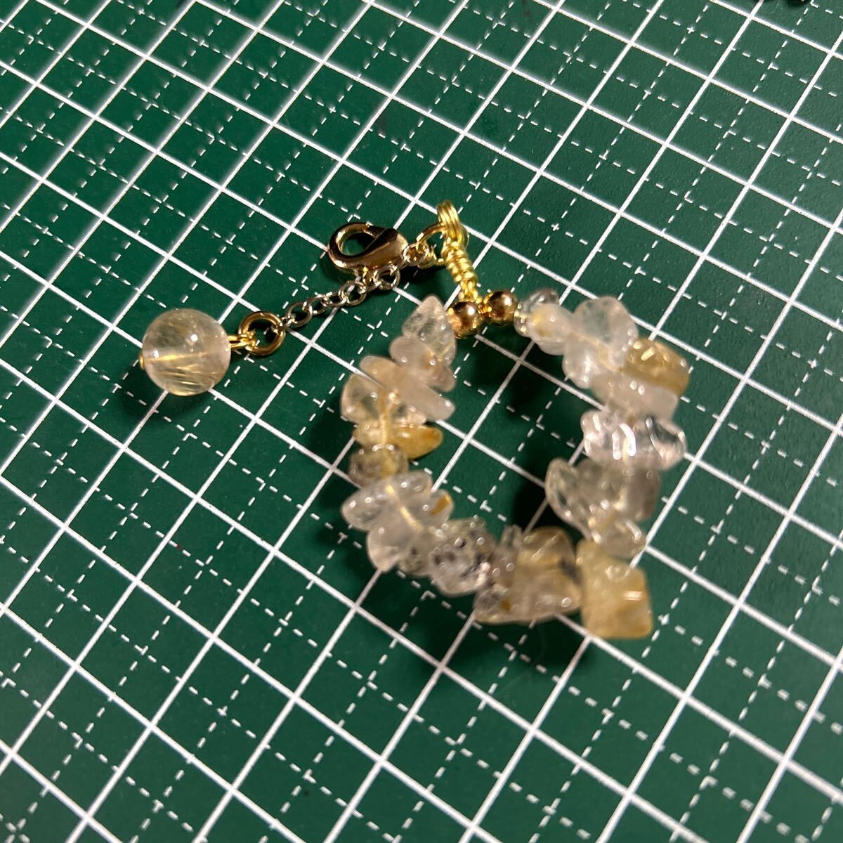  Gold rutile quartz 8 millimeter . small stone. strap 