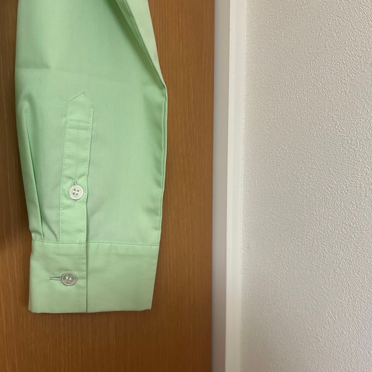 ナイスクラップ 緑色シャツ