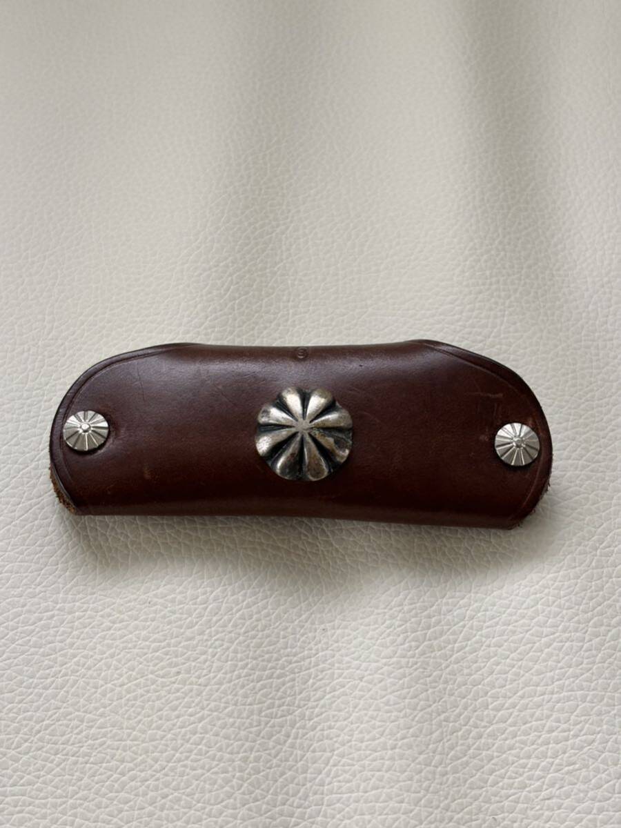 Button Works button Works leather Conti . key case 