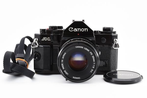 [良品]キヤノン CANON A-1 一眼レフ 35mm フィルムカメラ ブラック 黒 + FD 50mm f/1.8 S.C. 2134068_画像1