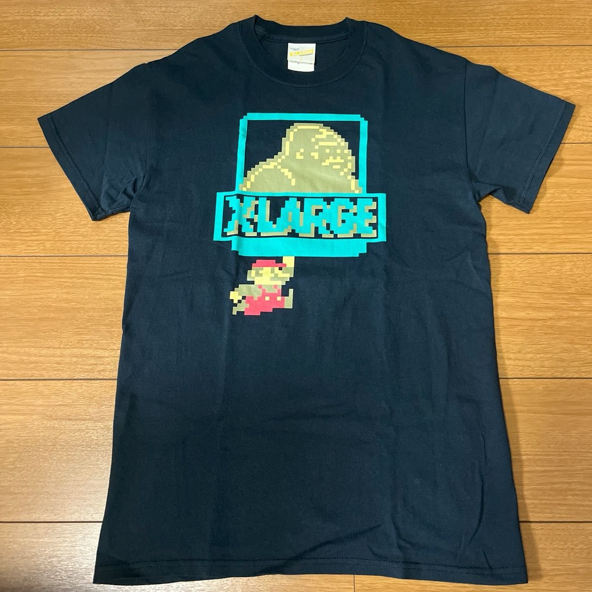 X-LARGE×スーパーマリオ 8bit OG Tシャツ(検:パーカー スウェット パンツ キャップ ベスト ジャケット)