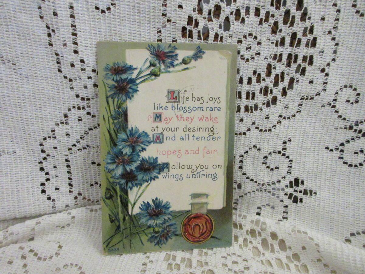アンティーク 絵葉書 ポストカード エンボス 青いお花 ヤグルマギク ワックス印シール 馬蹄 メッセージ アメリカ切手1910年の画像1