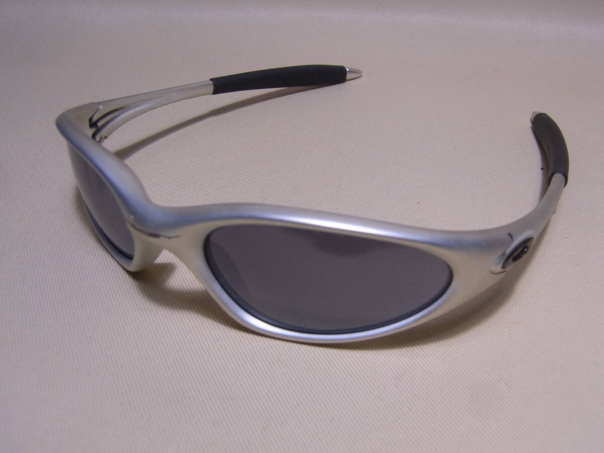 OAKLEY MINUTE 1.0 (FMJ5.56 シルバー系 / Black Iridium OAKLEY MINUTE 1.0 (FMJ5.56 シルバー系 / Black Iridium