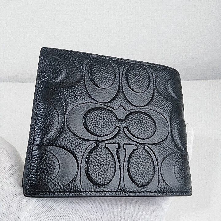 新品未使用 COACH シグネチャー エンボス加工 二つ折り財布 ブラック 未使用品 コーチ 二つ折り財布 エンボス シグネチャー レザー 本