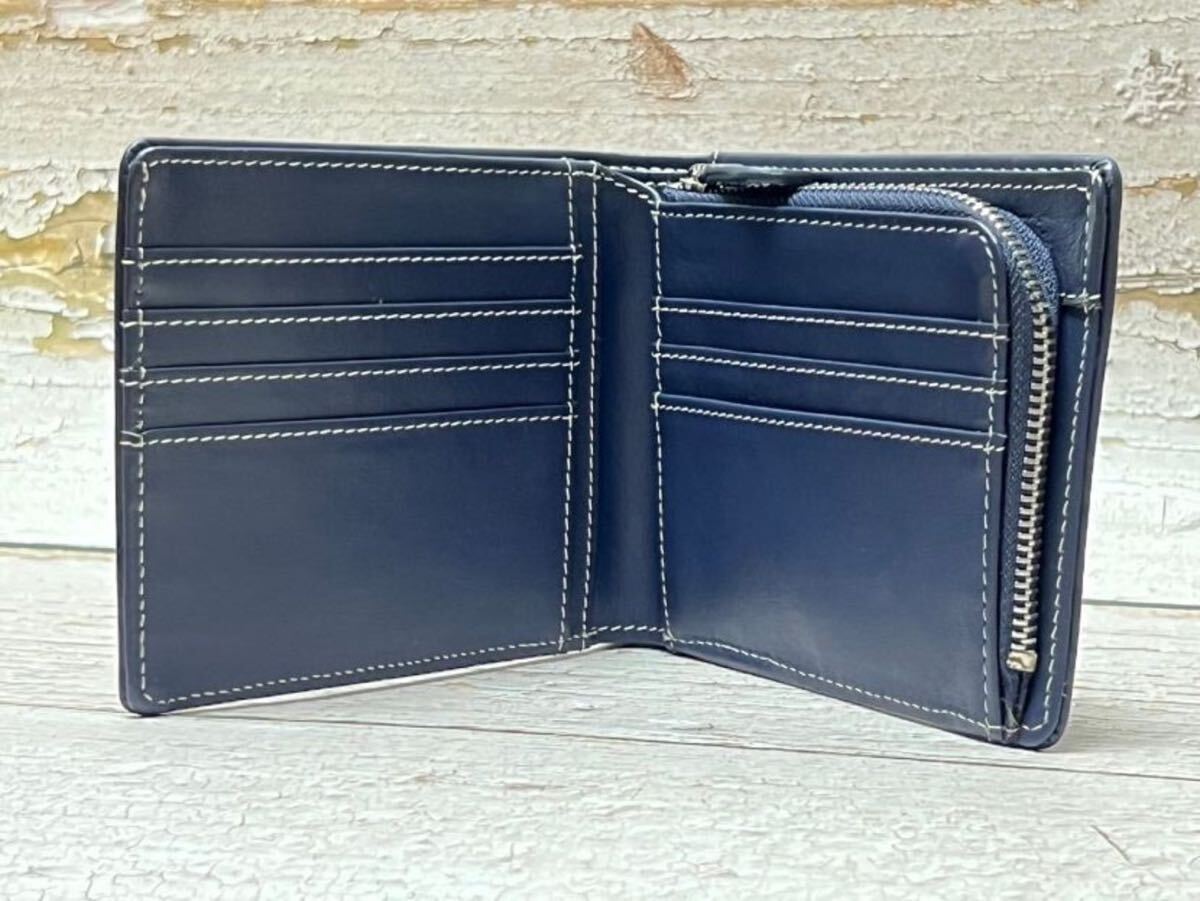 新作品 黒/赤 数量限定 無くなり次第終了 ドイツタンナーの本革 牛革 二つ折り財布 小銭入れ コンパクト 大人気商品 新作品 黒/赤 数量限定 無くなり次第終了 ドイツタンナーの本革 牛革 二つ折り財布 小銭入れ コンパクト 大人気商品