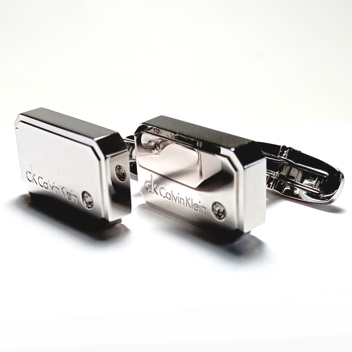 【ckc414】CALVIN KLEIN CKカルバンクライン カフス カフリンクス シルバー×クリアストーン ミラータイプ ロゴ入り_画像2