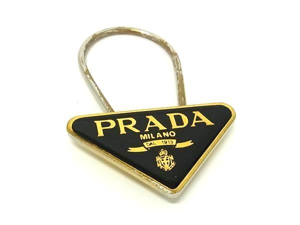 1円 PRADA プラダ M285 ロゴモチーフ キーホルダー バッグチャーム アクセサリー レディース ブラック系×ゴールド系 BJ4259