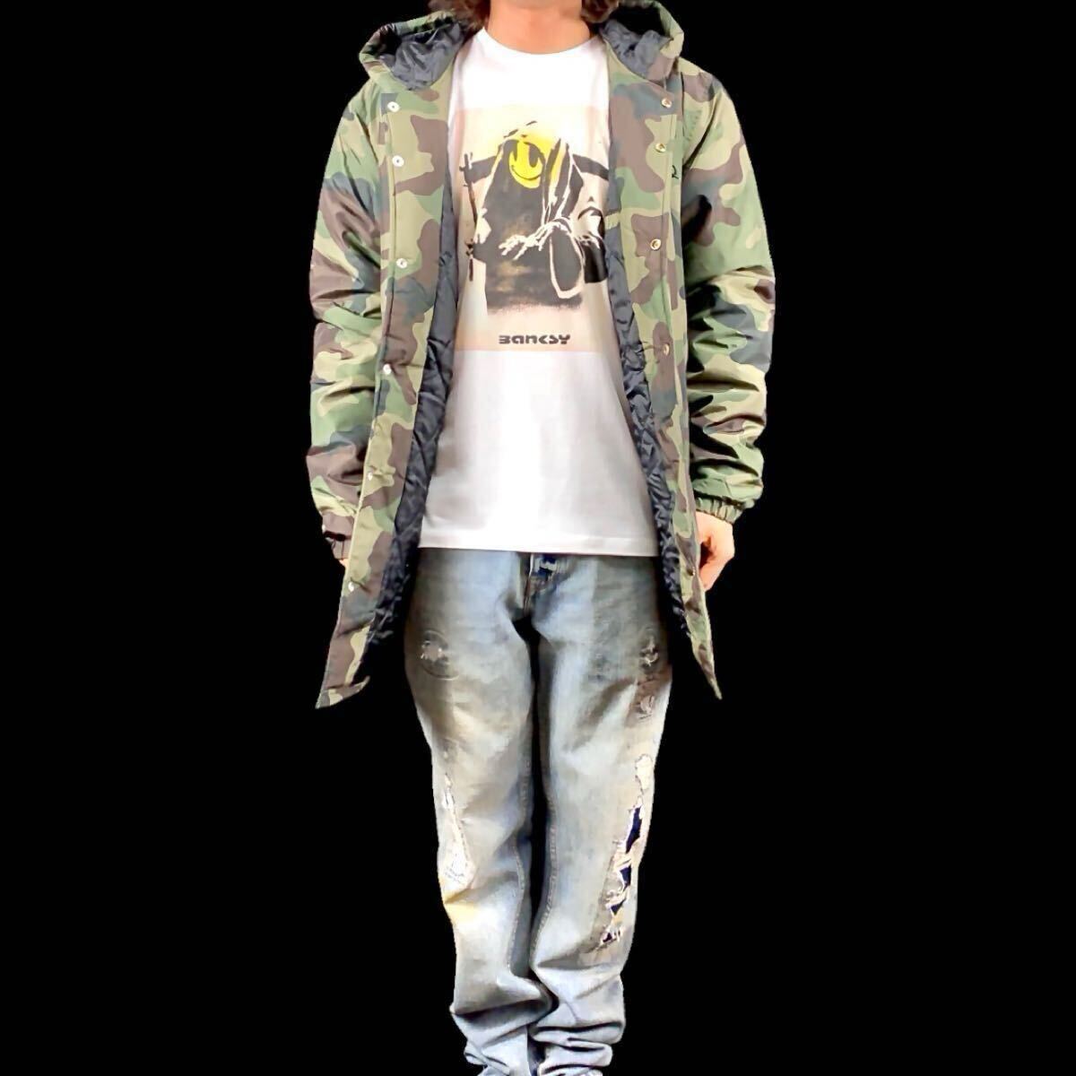 新品 未使用 BANKSY バンクシー ニコちゃん スマイリー ポリス T