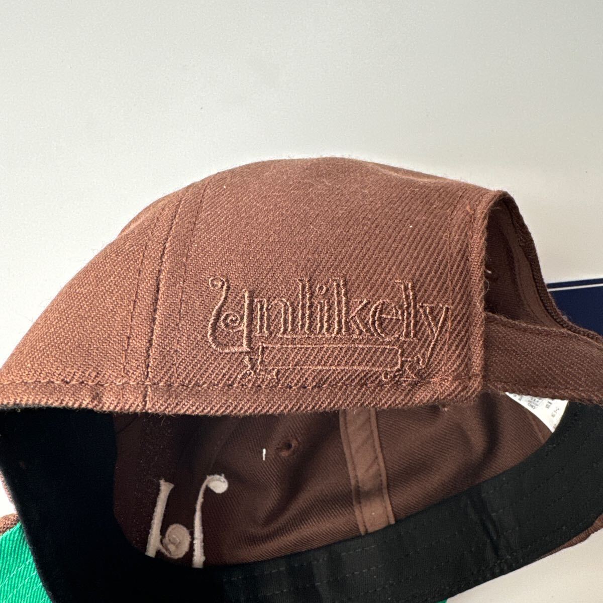 即完売 Unlikely×NEPENTHES NEW YORK CAP ブラウン アンライ 即完売 Unlikely×NEPENTHES NEW YORK CAP ブラウン アンライ