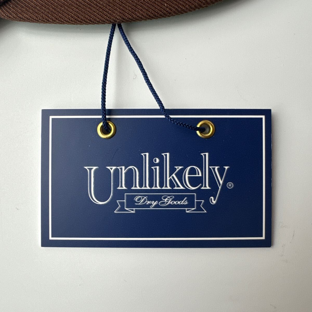 即完売 Unlikely×NEPENTHES NEW YORK CAP ブラウン アンライ