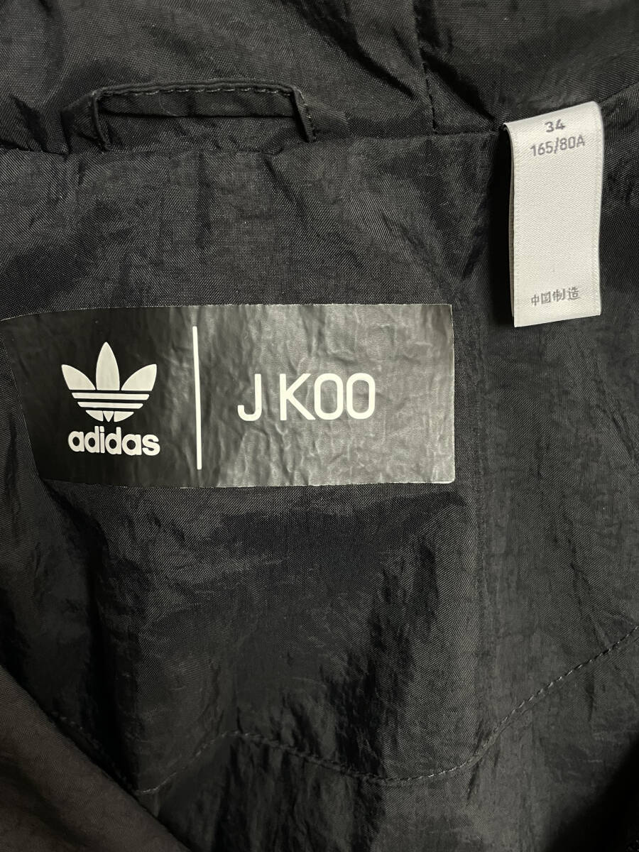adidas J KOO черный нейлон пончо asimeto Lee One-piece женский Adidas J Koo размер 34 б/у прекрасный товар 