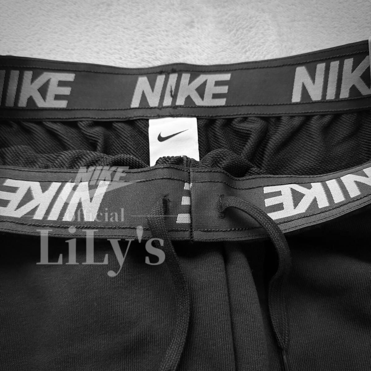 新品 ナイキ上下セットアップ Mサイズ スウォッシュ NIKE 黒白 新品 ナイキ上下セットアップ Mサイズ スウォッシュ NIKE 黒白