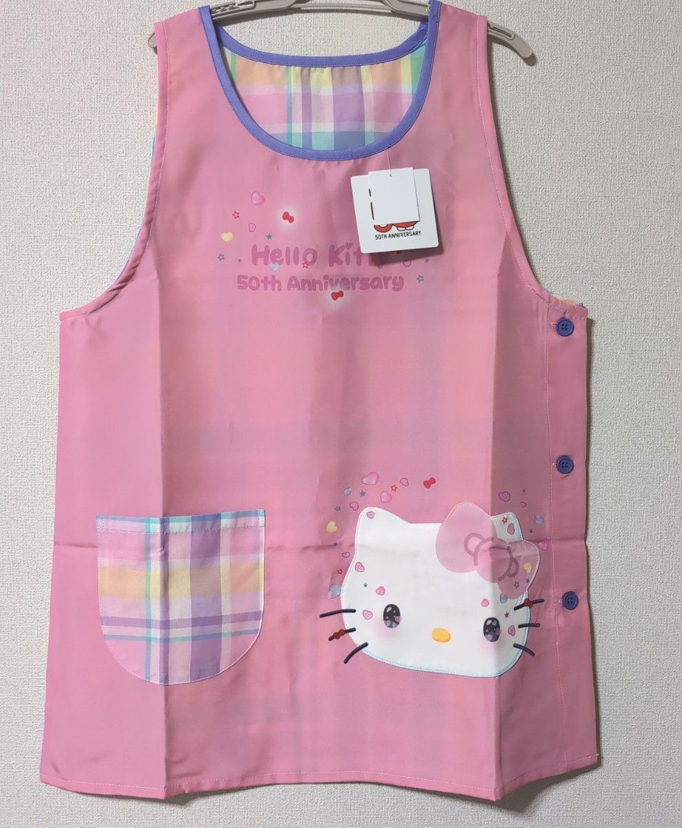 新品 ハローキティ 50周年 キティちゃん 顔ポケット エプロン 新品 ハローキティ 50周年 キティちゃん 顔ポケット エプロン