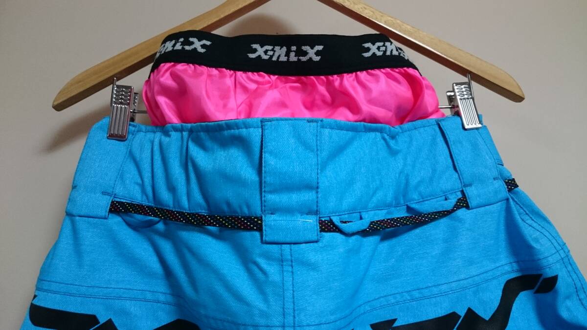 X－NIX [エクスニクス]スノーボードウエア (パンツ)/Ｍサイズ/ターコイズブルー×ショッキングピンク/美品/未使用品