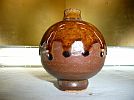 A_ cologne ..... lamp shape. light brown group glaze shide. beautiful one wheel .. diameter 8cm height 10cm